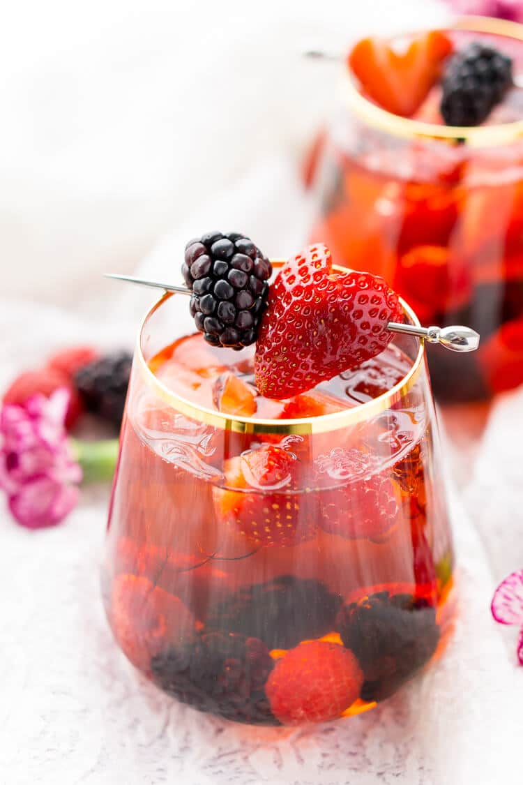 Rosé Berry Sangria is the perfect batch cocktail for Valentine's Day, Bridal Showers, and more! Made with rosé wine, Chambord, blackberry brandy, lemon-lime soda, and fresh berries!