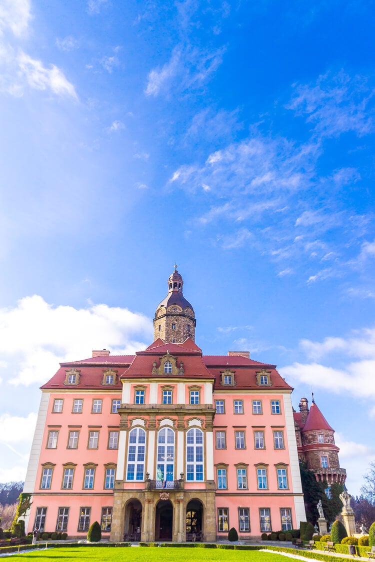 Ksiaz Castle & Hotel in Poland is a charming castle with budget-friendly accommodations nestled in the hills and mountains of Poland. Stay the night, explore the maze of corridors, and take in the gorgeous grounds while you're there!