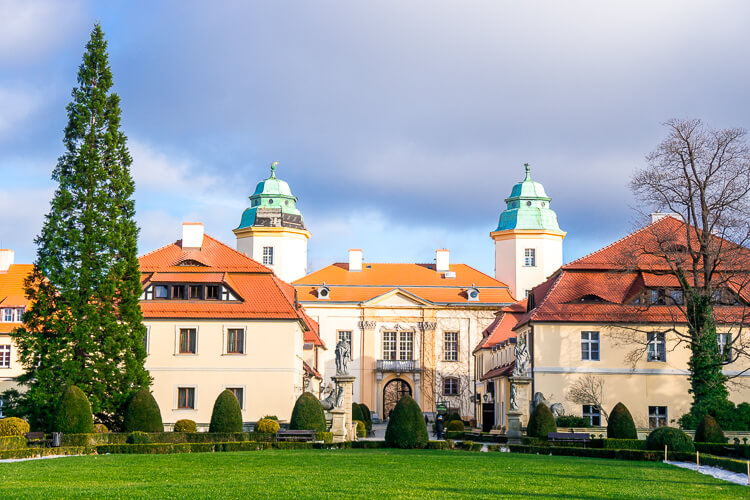 Ksiaz Castle & Hotel in Poland is a charming castle with budget-friendly accommodations nestled in the hills and mountains of Poland. Stay the night, explore the maze of corridors, and take in the gorgeous grounds while you're there!