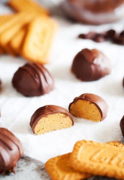 These Cookie Butter Balls are like classic peanut butter balls but made with cookie butter instead! An addition of graham crackers, sugar, and chocolate makes them a delicious holiday or everyday treat!