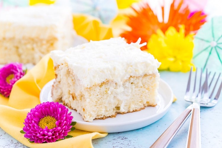 This Coconut Poke Cake is easy to make, loaded with coconut flavor, and the perfect dessert for your spring and summer celebrations. 