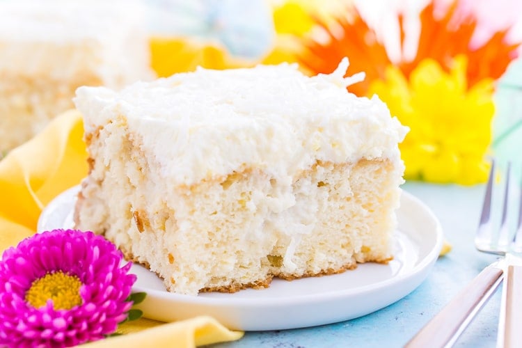 This Coconut Poke Cake is easy to make, loaded with coconut flavor, and the perfect dessert for your spring and summer celebrations. 