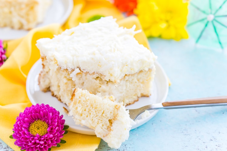 This Coconut Poke Cake is easy to make, loaded with coconut flavor, and the perfect dessert for your spring and summer celebrations. 