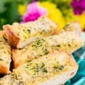 This Parmesan Garlic Bread is the perfect side for Bertolli's Frozen Chicken Florentine. A quick and easy recipe loaded with herbs, butter, and Parmesan cheese that can be whipped up in minutes!