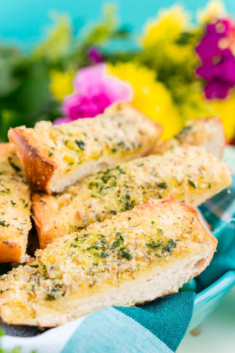 This Parmesan Garlic Bread is the perfect side for Bertolli's Frozen Chicken Florentine. A quick and easy recipe loaded with herbs, butter, and Parmesan cheese that can be whipped up in minutes!