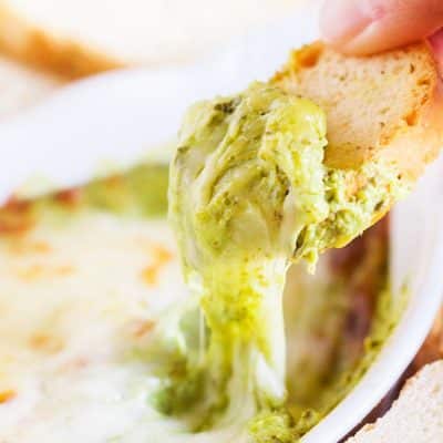 This Baked Spinach Artichoke Dip is a must have at any party. With two different prep methods, you can make it either hearty or creamy!