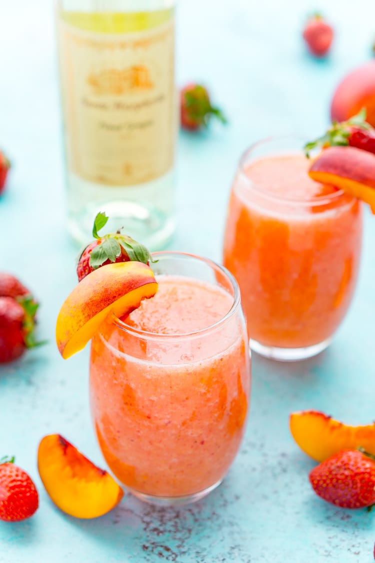 Strawberry Peach Wine Slushies are made with just a few ingredients and a blender. Mix them up for a night with the girls or a summer day by the pool!
