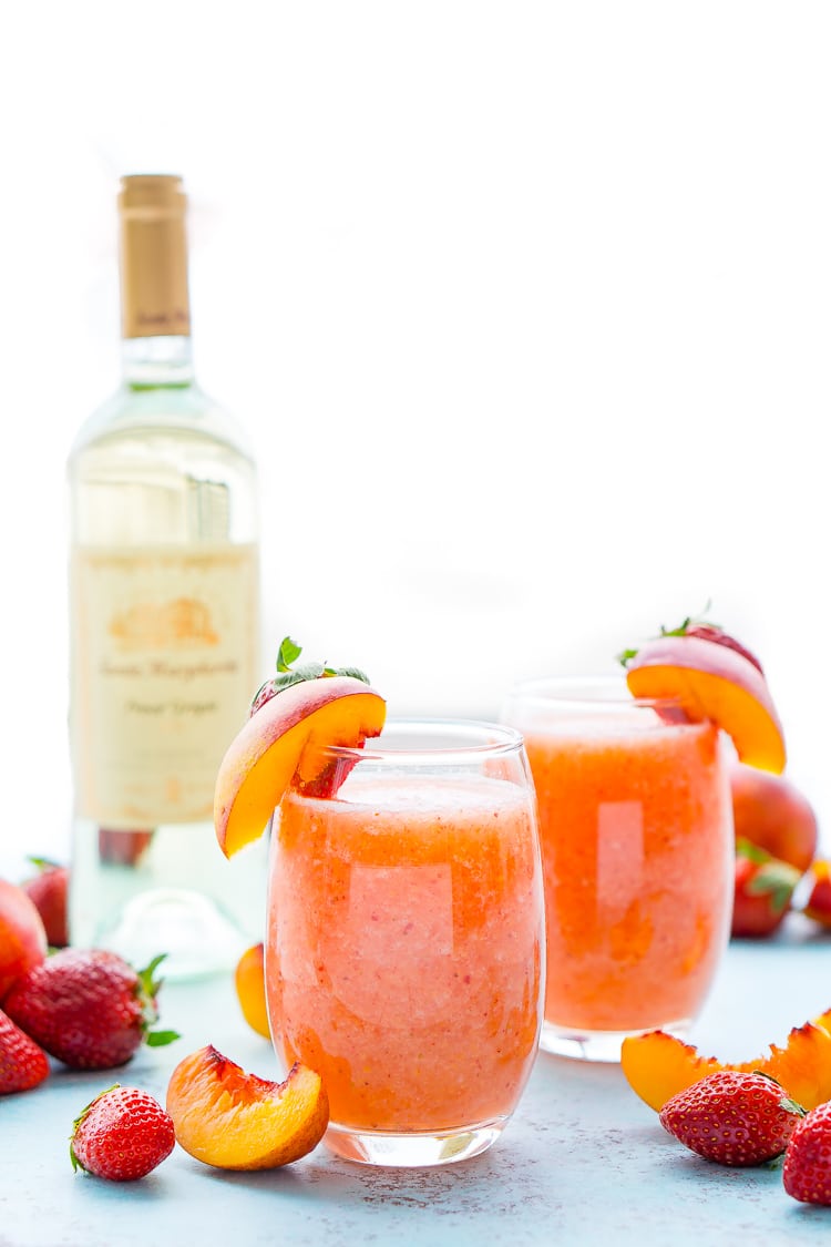 Strawberry Peach Wine Slushies are made with just a few ingredients and a blender. Mix them up for a night with the girls or a summer day by the pool!