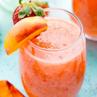 Strawberry Peach Wine Slushies are made with just a few ingredients and a blender. Mix them up for a night with the girls or a summer day by the pool!