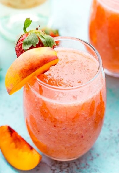 Strawberry Peach Wine Slushies are made with just a few ingredients and a blender. Mix them up for a night with the girls or a summer day by the pool!