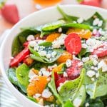 This Strawberry Spinach Salad will become your new go-to recipe for summer, it's made with simple, flavorful ingredients like goat cheese, almonds, poppyseeds, strawberries, mandarins, and spinach, and you can make it family or party-sized!