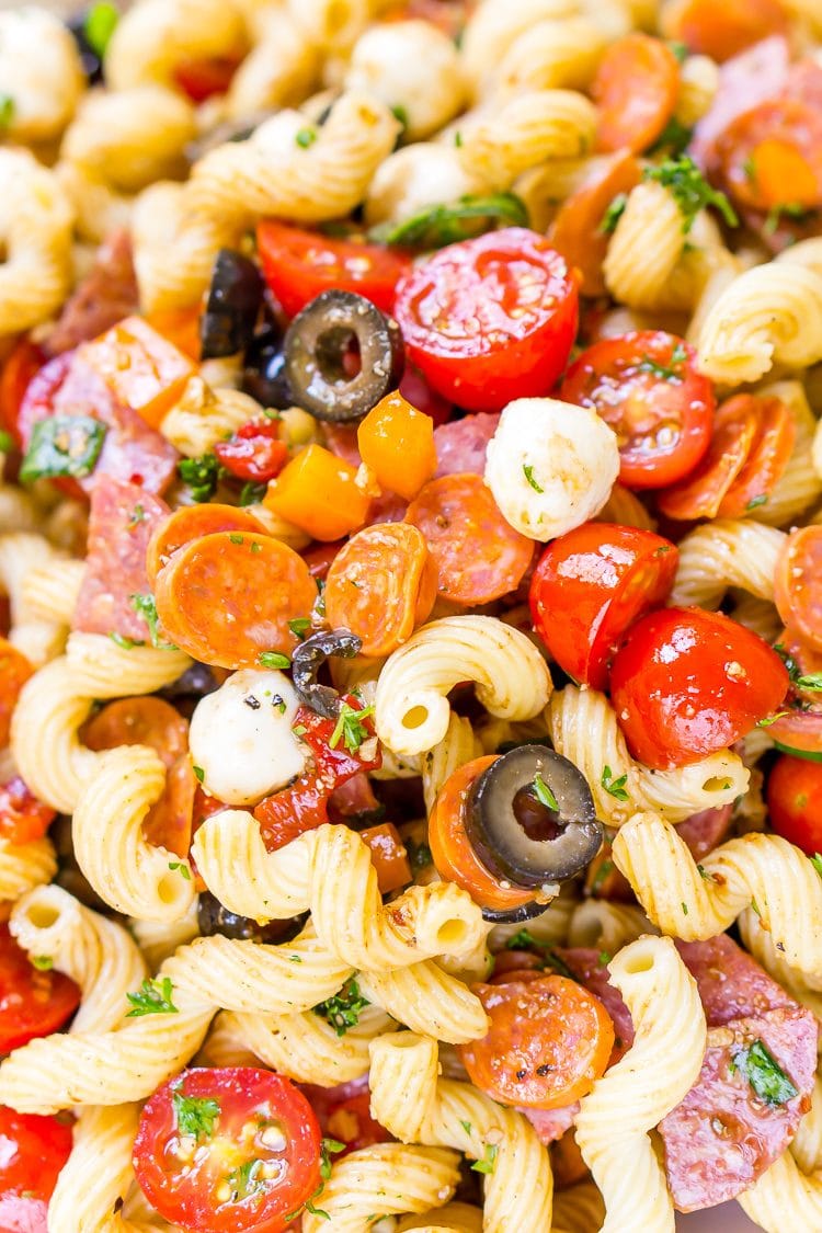 Antipasti Pasta Salad recipe is loaded with veggies, cheeses, herbs, and meats and coated in a simple balsamic and olive oil dressing.