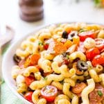 Antipasti Pasta Salad is loaded with veggies, cheeses, herbs, and meats and coated in a simple balsamic and olive oil dressing. Perfect for large get-togethers like BBQs and potlucks!