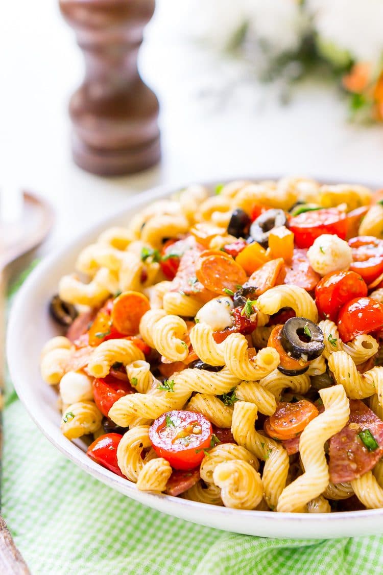 Antipasti Pasta Salad recipe is loaded with veggies, cheeses, herbs, and meats and coated in a simple balsamic and olive oil dressing.