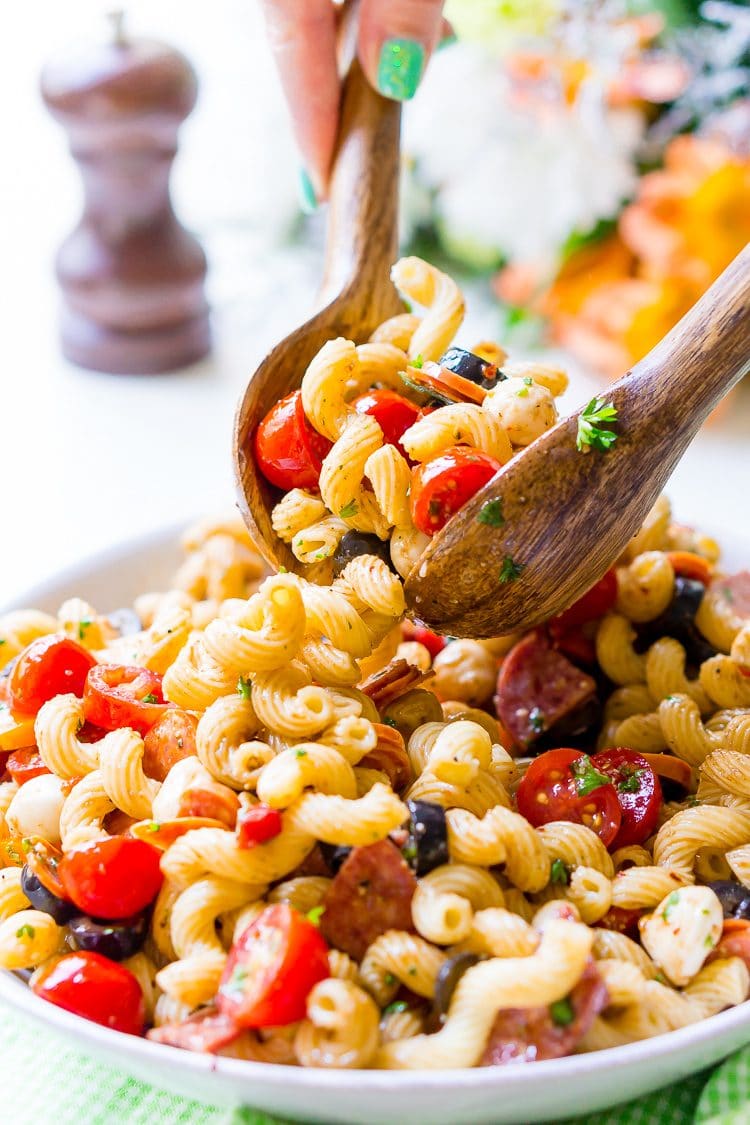 Antipasti Pasta Salad recipe is loaded with veggies, cheeses, herbs, and meats and coated in a simple balsamic and olive oil dressing.