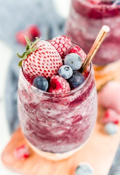 Sangria Slushies are loaded with berry and citrus flavors and Red Moscato making it the perfect frozen cocktail for summer!