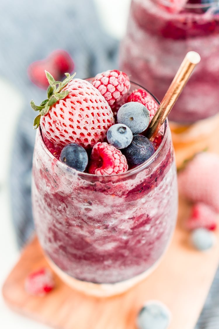 Sangria Slushies are loaded with berry and citrus flavors and Red Moscato making it the perfect frozen cocktail for summer!