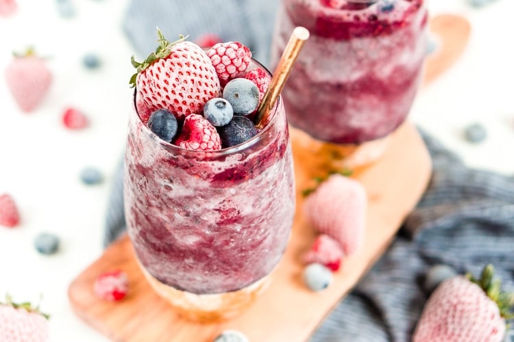 Sangria Slushies are loaded with berry and citrus flavors and Red Moscato making it the perfect frozen cocktail for summer!