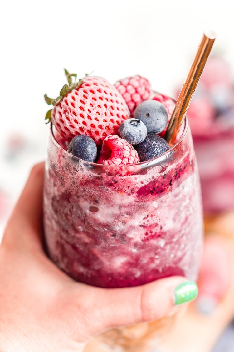 Sangria Slushies are loaded with berry and citrus flavors and Red Moscato making it the perfect frozen cocktail for summer!