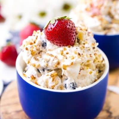 This Red White & Blue Ambrosia Salad is a delicious, no-bake, retro dessert recipe that's easy, addictive, and loaded with strawberries, blueberries, coconut, and pineapple!