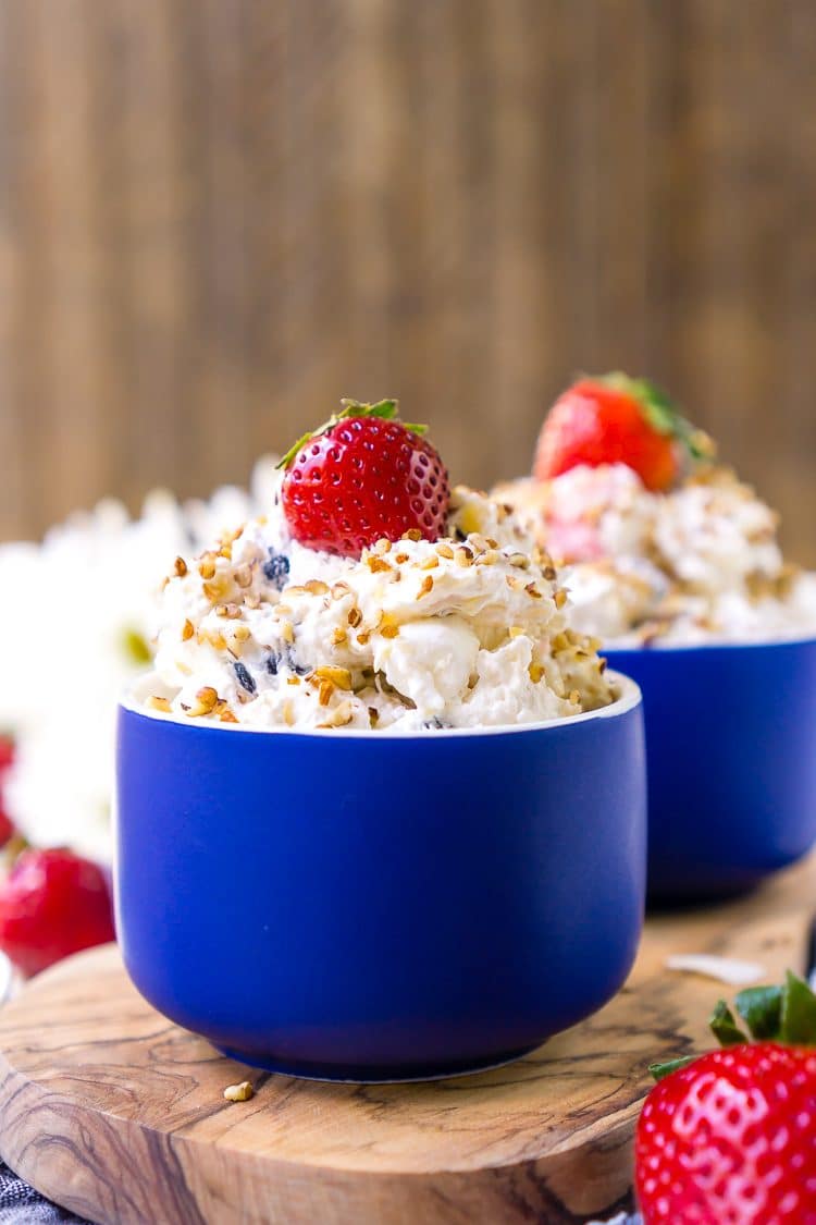 This Red White & Blue Ambrosia Salad is a delicious, no-bake, retro dessert recipe that's easy, addictive, and loaded with strawberries, blueberries, coconut, and pineapple!