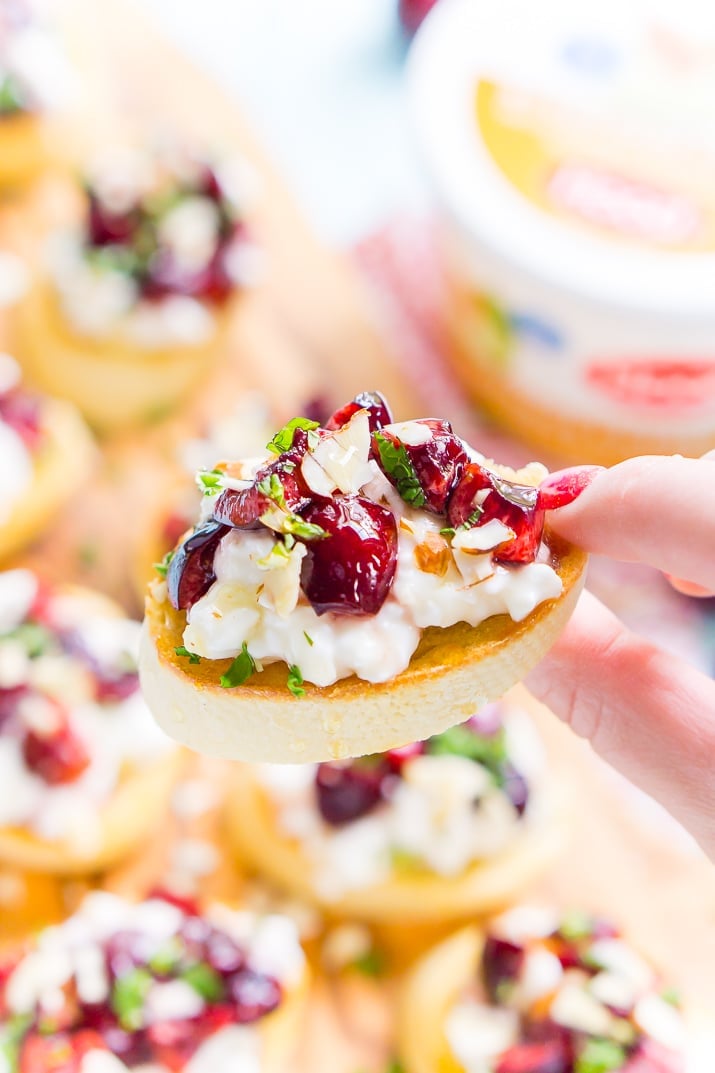 This Cottage Cheese & Cherry Crostini is a fresh and delicious appetizer recipe. Toasted bread topped with silky cottage cheese, cherries, almonds, honey, and mint!