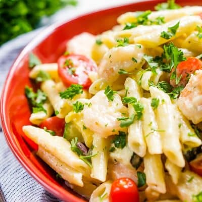 This Shrimp Alfredo is loaded with delicious shrimp, fresh veggies, and a creamy alfredo sauce that will have the whole family running to the table! Serve it up with the pasta of your choice!