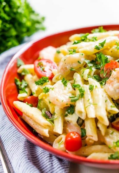 This Shrimp Alfredo is loaded with delicious shrimp, fresh veggies, and a creamy alfredo sauce that will have the whole family running to the table! Serve it up with the pasta of your choice!