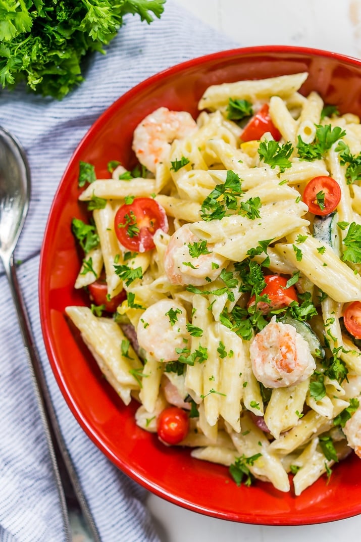 This Shrimp Alfredo is loaded with delicious shrimp, fresh veggies, and a creamy alfredo sauce that will have the whole family running to the table! Serve it up with the pasta of your choice!