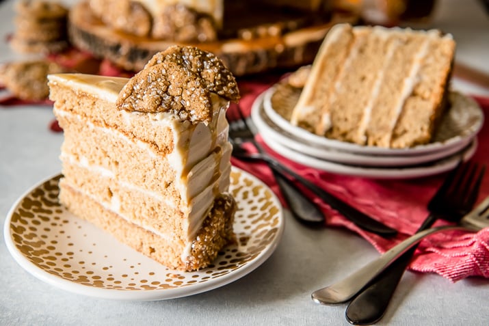 Seasonal and comforting, this Boozy Bourbon Caramel Spice Cake is full of fall flavors, covered in a caramel bourbon cream cheese buttercream, and garnished with your favorite gingersnap cookies!