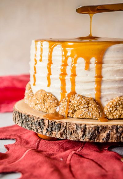 Seasonal and comforting, this Boozy Bourbon Caramel Spice Cake is full of fall flavors, covered in a caramel bourbon cream cheese buttercream, and garnished with your favorite gingersnap cookies!