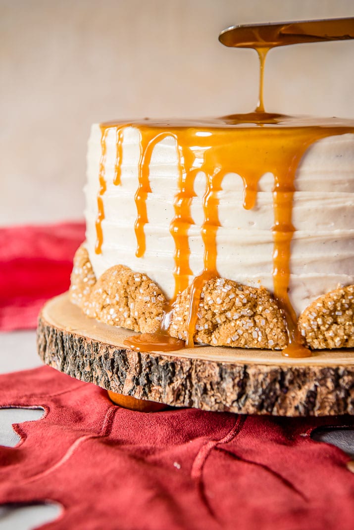 Seasonal and comforting, this Boozy Bourbon Caramel Spice Cake is full of fall flavors, covered in a caramel bourbon cream cheese buttercream, and garnished with your favorite gingersnap cookies!