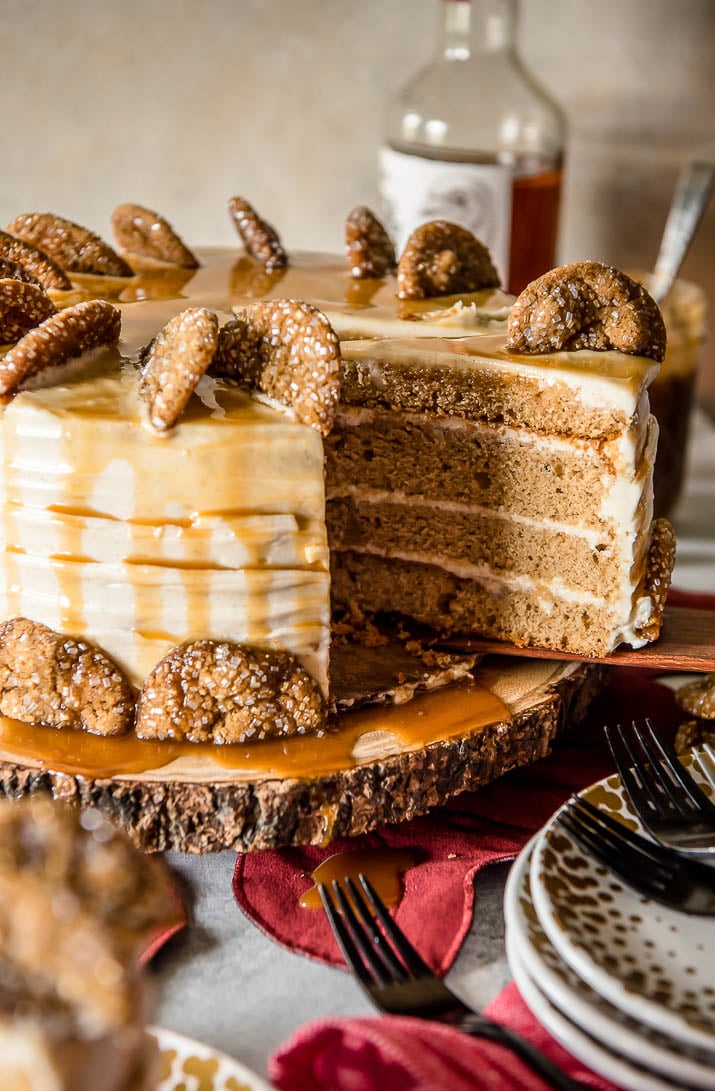 Seasonal and comforting, this Boozy Bourbon Caramel Spice Cake is full of fall flavors, covered in a caramel bourbon cream cheese buttercream, and garnished with your favorite gingersnap cookies!