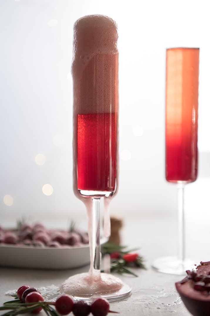 This pretty Cranberry Pomegranate Champagne Cocktail will fit right in during all your holiday festivities, but is versatile enough to be enjoyed any time of the year!