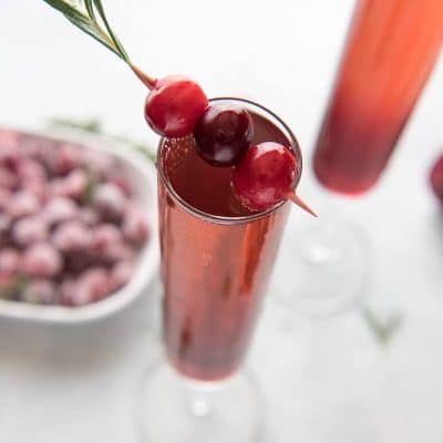 This pretty Cranberry Pomegranate Champagne Cocktail will fit right in during all your holiday festivities, but is versatile enough to be enjoyed any time of the year!