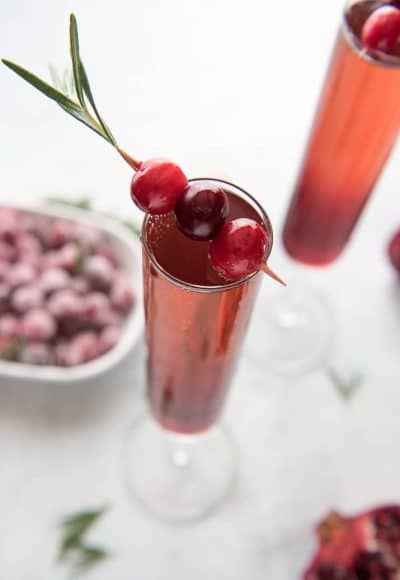 This pretty Cranberry Pomegranate Champagne Cocktail will fit right in during all your holiday festivities, but is versatile enough to be enjoyed any time of the year!