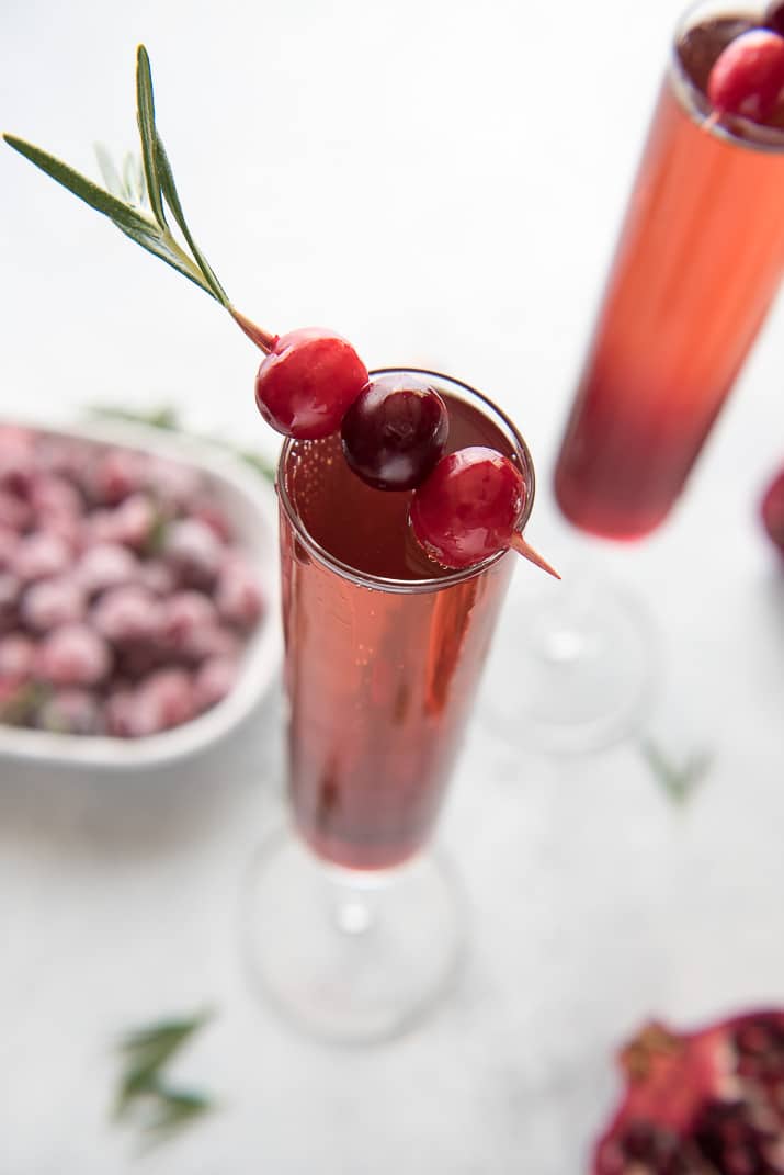 This pretty Cranberry Pomegranate Champagne Cocktail will fit right in during all your holiday festivities, but is versatile enough to be enjoyed any time of the year!