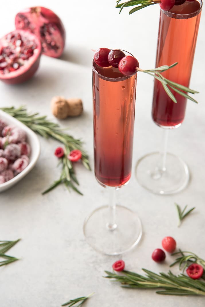 This pretty Cranberry Pomegranate Champagne Cocktail will fit right in during all your holiday festivities, but is versatile enough to be enjoyed any time of the year!