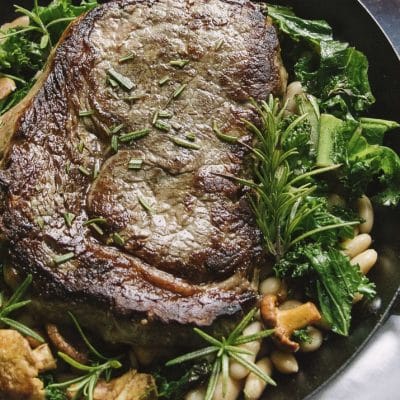 This Epic Rib Eye Steak is the perfect one pan dinner. Juicy beef, fragrant rosemary, and crispy kale make this the perfect recipe for date night in or is elegant enough to serve company.