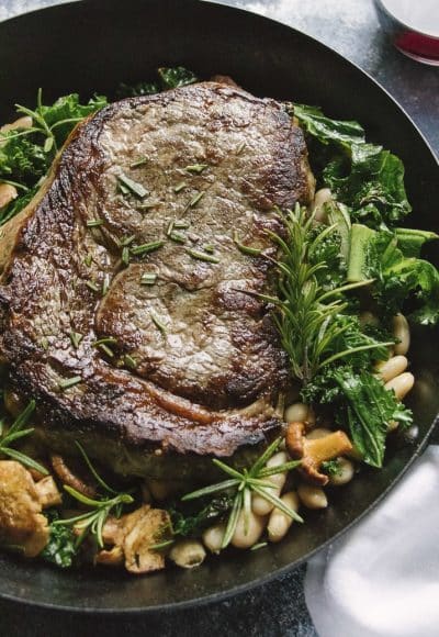 This Epic Rib Eye Steak is the perfect one pan dinner. Juicy beef, fragrant rosemary, and crispy kale make this the perfect recipe for date night in or is elegant enough to serve company.