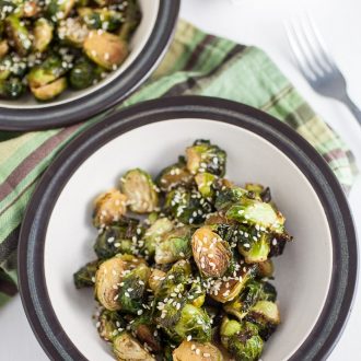 These simple Roasted Brussels Sprouts are topped with a maple sesame glaze that gives them the perfect balance of both sweet and savory flavor!