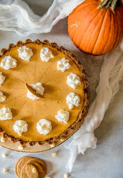 Present that traditional pumpkin pie in a more festive way with this White Chocolate Pumpkin Cheesecake Tart! Pumpkin cheesecake, infused with white chocolate and nestled in a gingersnap crust, is going to be your new favorite holiday dessert!
