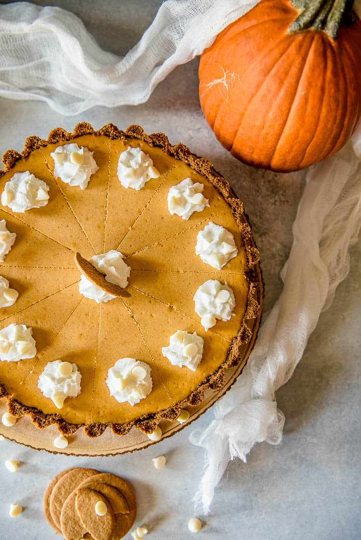 Present that traditional pumpkin pie in a more festive way with this White Chocolate Pumpkin Cheesecake Tart! Pumpkin cheesecake, infused with white chocolate and nestled in a gingersnap crust, is going to be your new favorite holiday dessert!