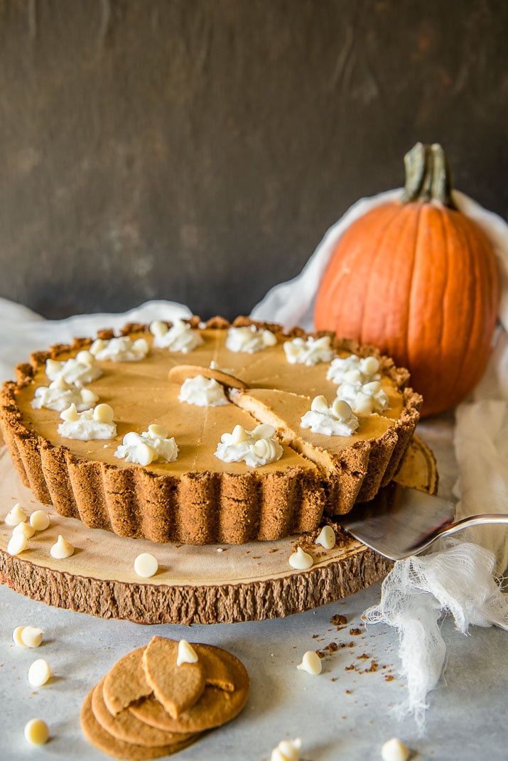 Present that traditional pumpkin pie in a more festive way with this White Chocolate Pumpkin Cheesecake Tart! Pumpkin cheesecake, infused with white chocolate and nestled in a gingersnap crust, is going to be your new favorite holiday dessert!