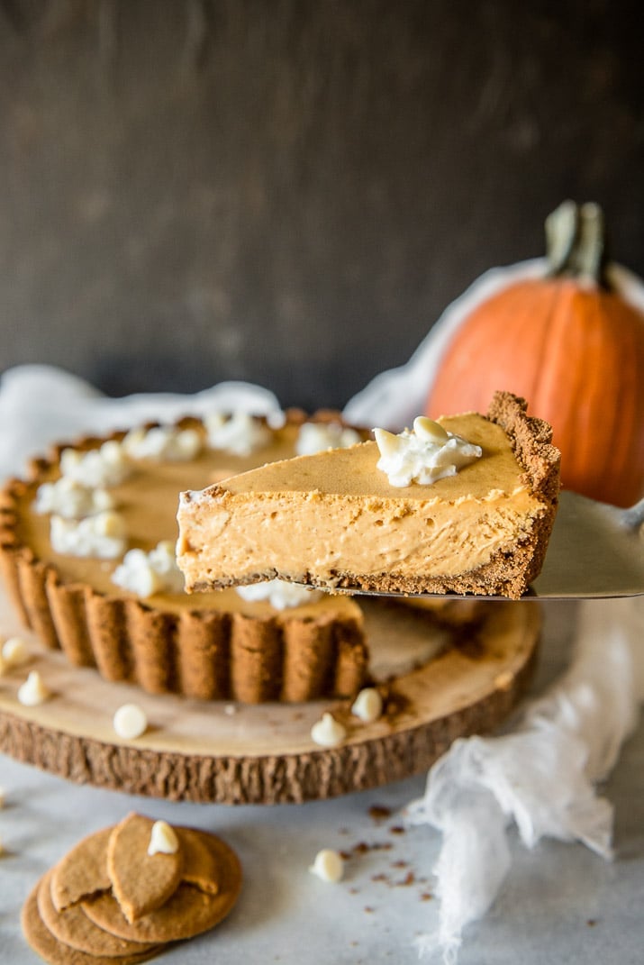 Present that traditional pumpkin pie in a more festive way with this White Chocolate Pumpkin Cheesecake Tart! Pumpkin cheesecake, infused with white chocolate and nestled in a gingersnap crust, is going to be your new favorite holiday dessert!