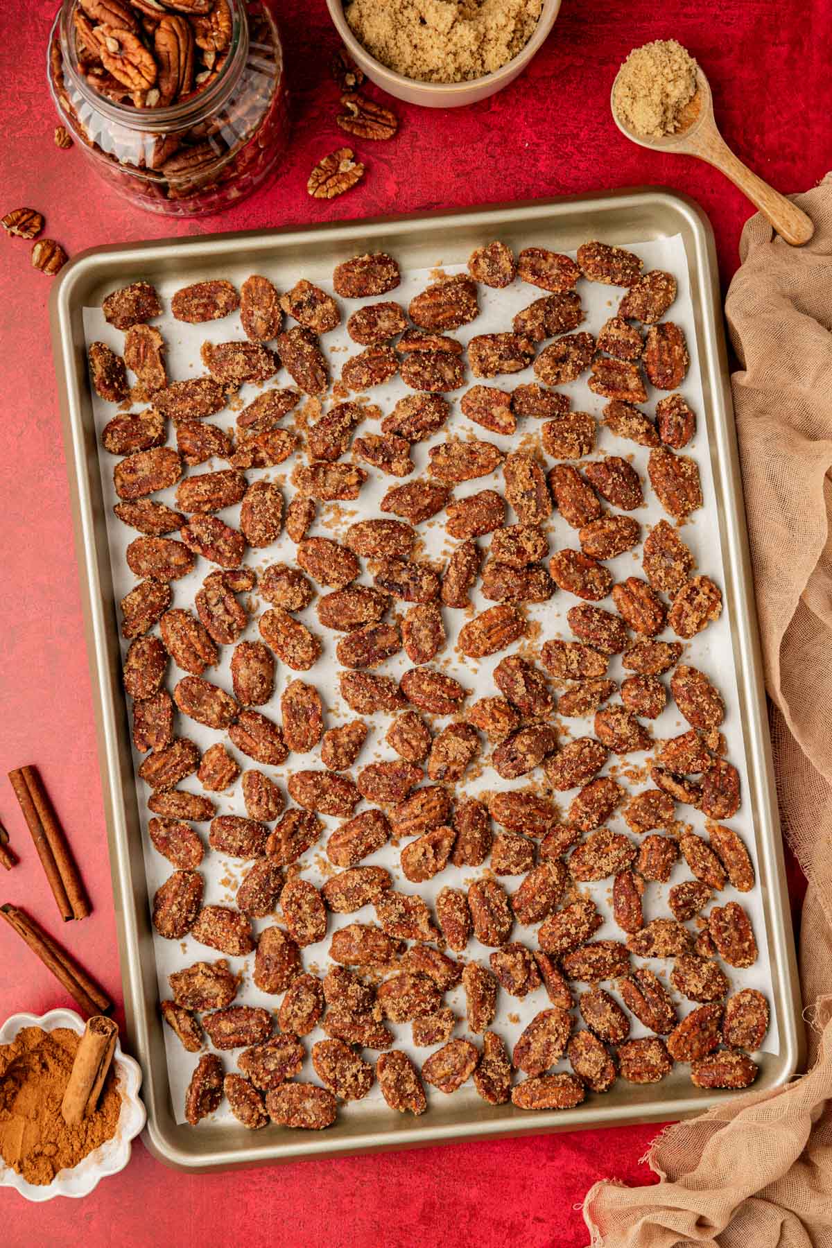 Overhead photo of a sheet pan with candied pecans on it.