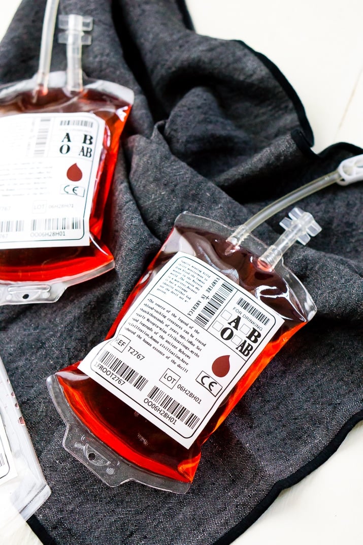 This Blood Bag Cocktail is the perfect quick drink for all your Halloween parties! Made with two ingredients, this drink is an easy and deliciously spooky libation!