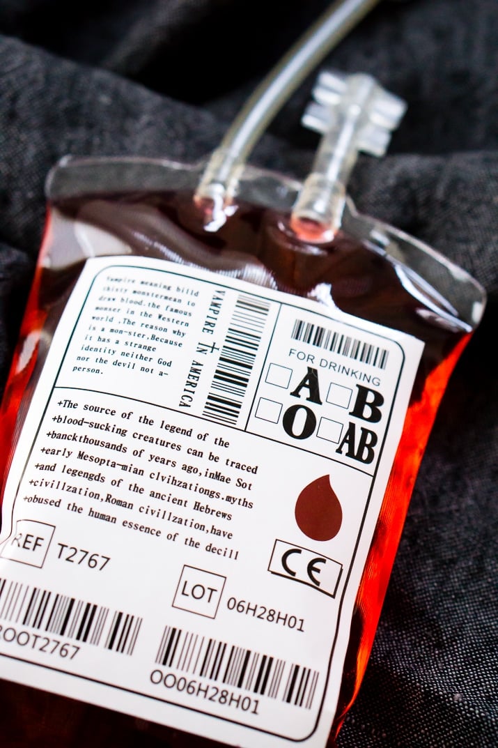 This Blood Bag Cocktail is the perfect quick drink for all your Halloween parties! Made with two ingredients, this drink is an easy and deliciously spooky libation!