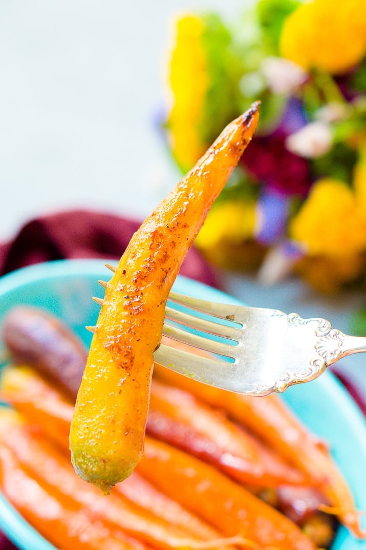 These Orange Braised Carrots are bound to be a highlight on your dinner table! Made with fresh-squeezed orange juice, butter, shallots, black pepper, and turmeric, this is one delicious side dish recipe!