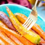 These Orange Braised Carrots are bound to be a highlight on your dinner table! Made with fresh-squeezed orange juice, butter, shallots, black pepper, and turmeric, this is one delicious side dish recipe!